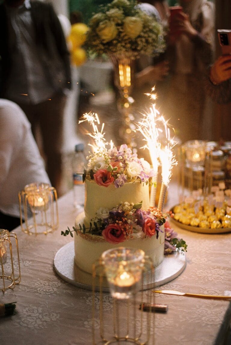 A wedding cake with sparklers on top