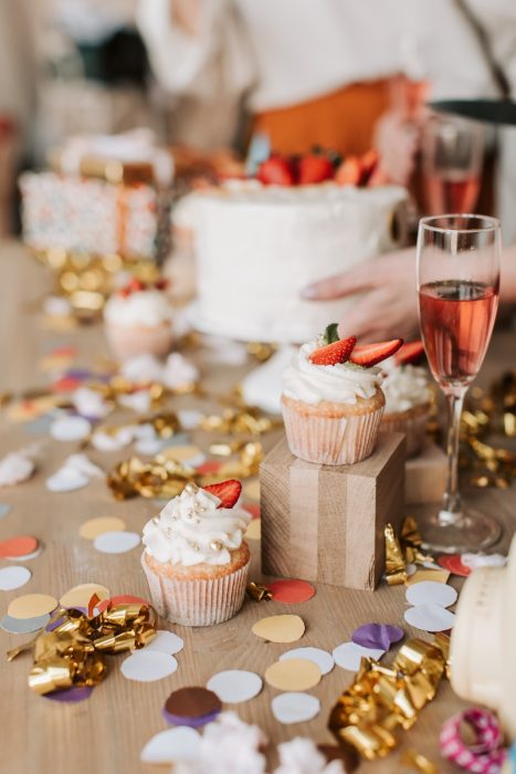 Photo of Cupcakes Near a Glass of Champagne